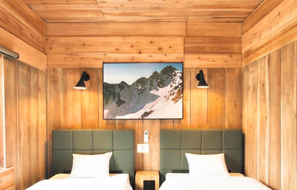Postel nebo postele na pokoji v ubytování Guesthouse Shimashima