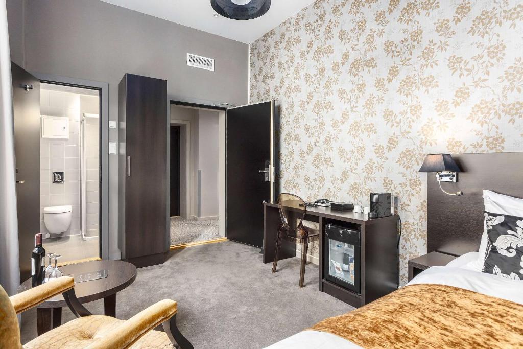 Postel nebo postele na pokoji v ubytování Saga Hotel Oslo, WorldHotels Crafted