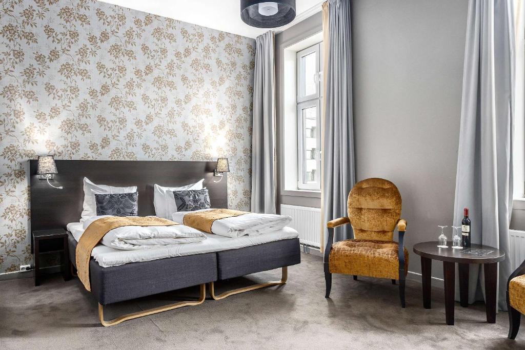 Postel nebo postele na pokoji v ubytování Saga Hotel Oslo, WorldHotels Crafted