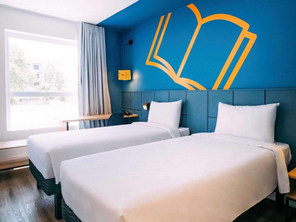 Postel nebo postele na pokoji v ubytování ibis Styles Poços de Caldas