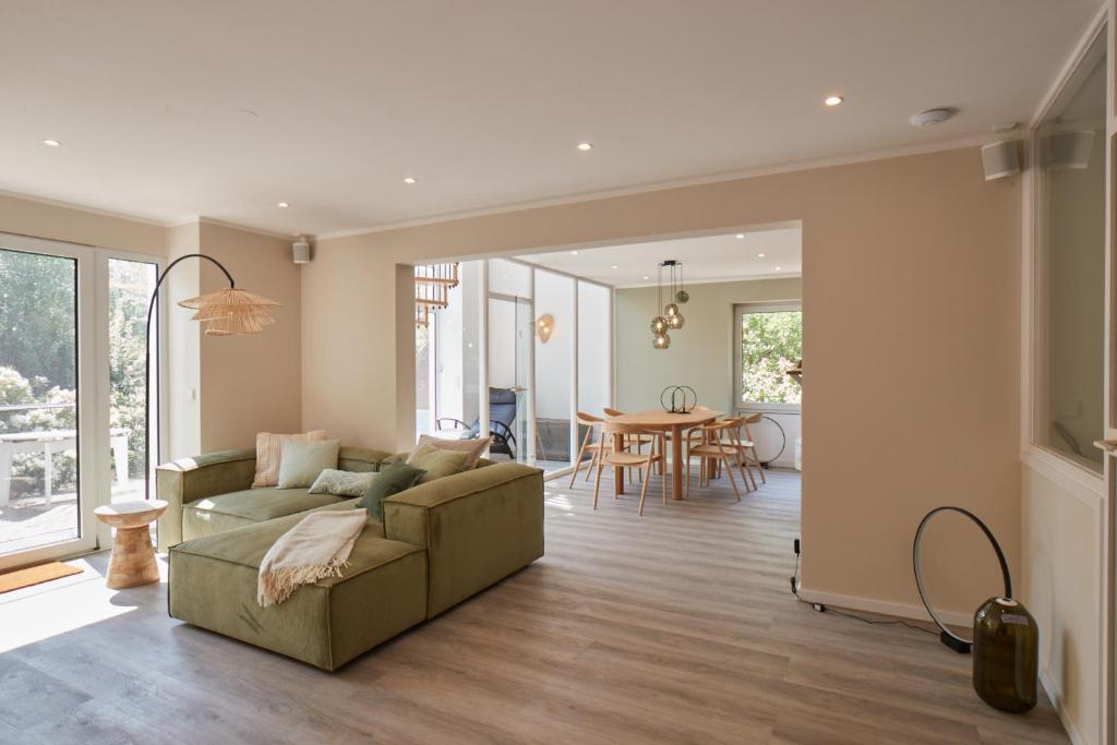 a living room with a couch and a table at Haus Hafen in Olsdorf