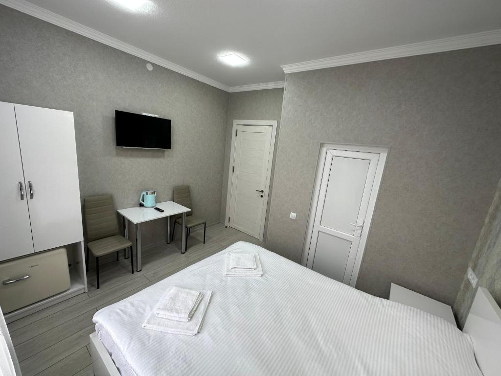 Letto o letti in una camera di Hotel Elit
