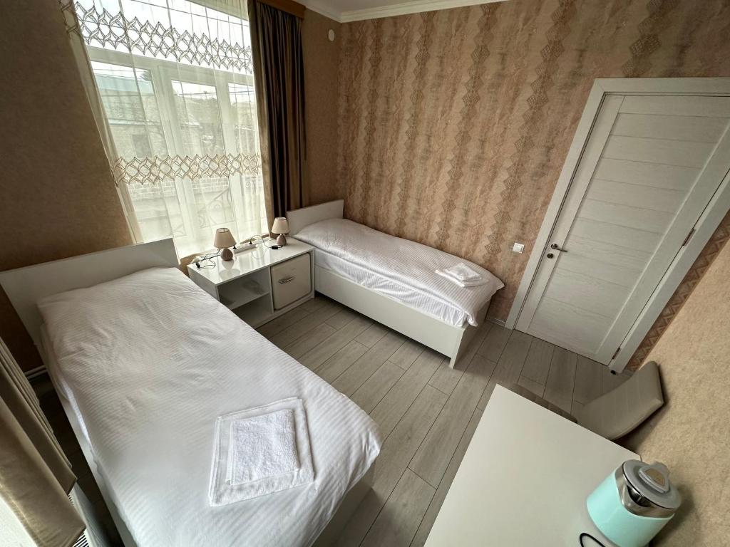 Letto o letti in una camera di Hotel Elit