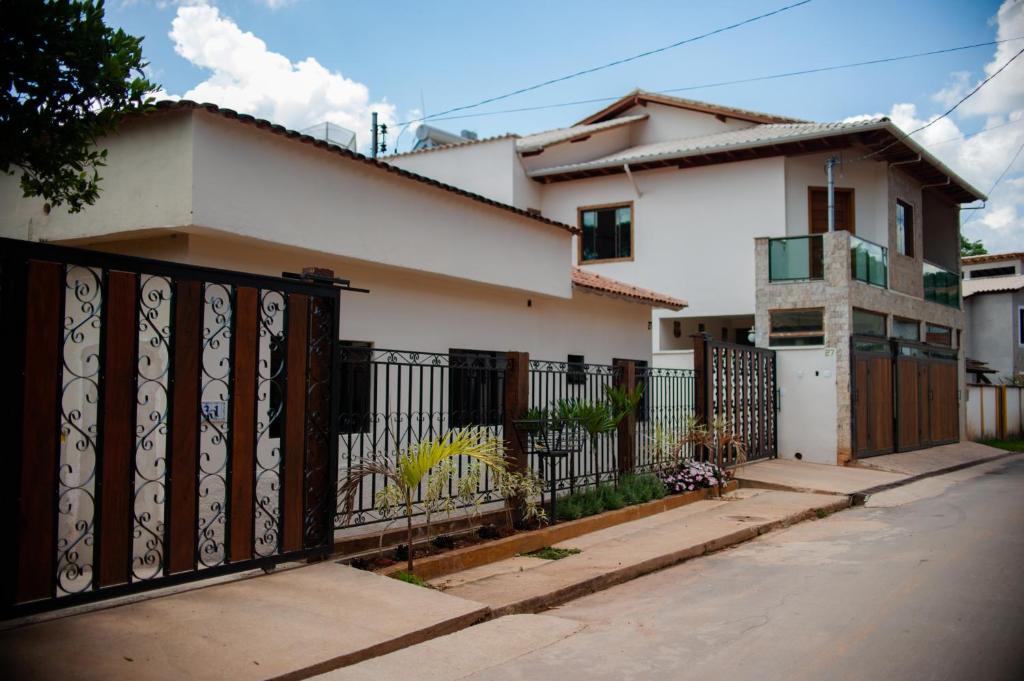 a house with a gate in front of it at Casa Temporada Tiradentes in Tiradentes