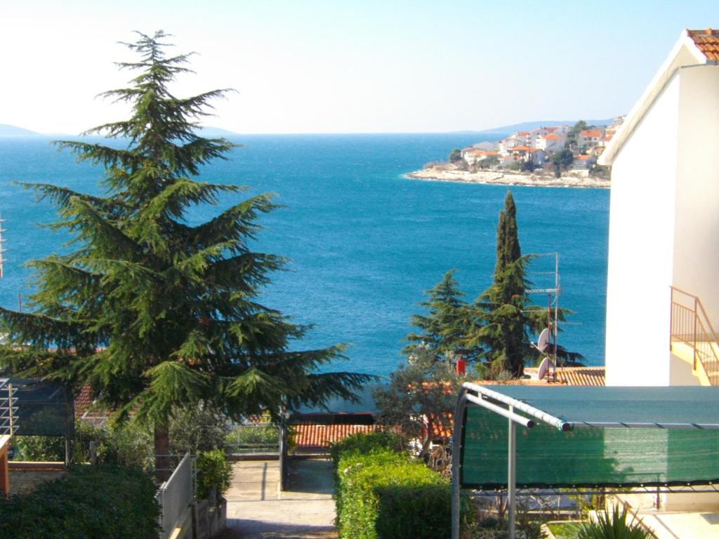 a view of the ocean from a house at Luna Apartments in Trogir