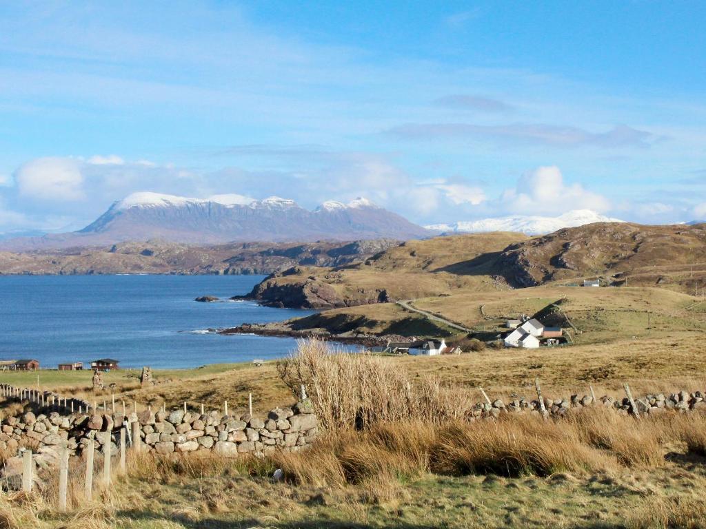 a view of a hill with a mountain in the background at Eagle Cottage in Culkein