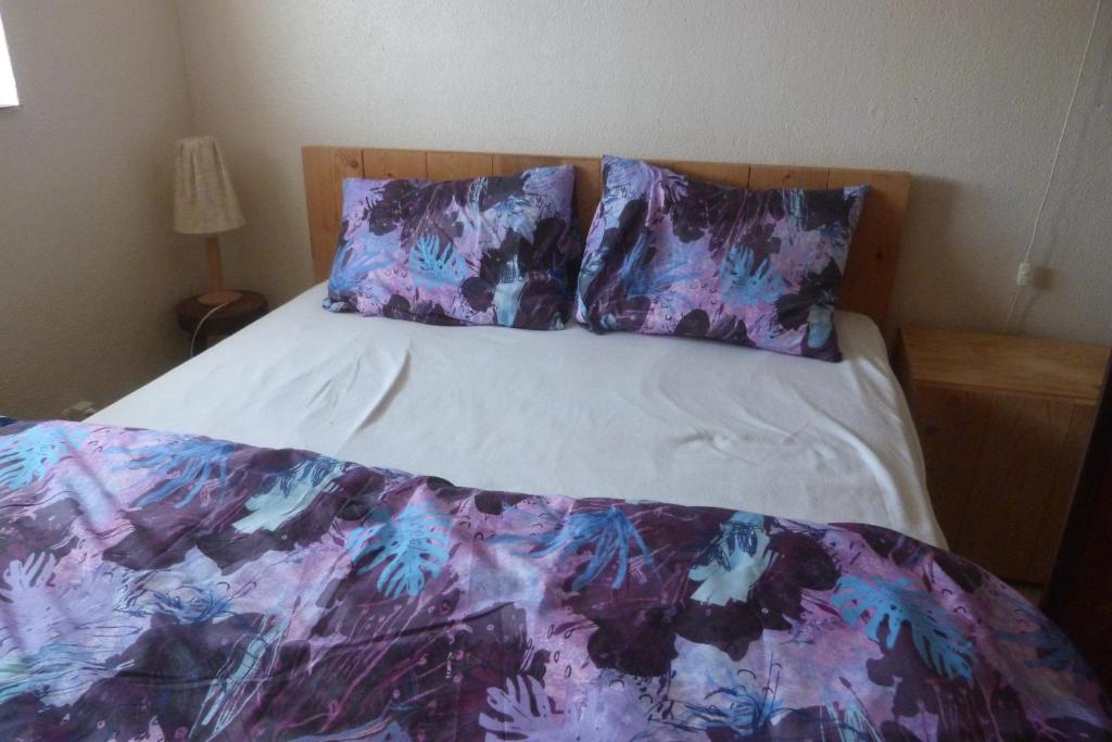 Postel nebo postele na pokoji v ubytování Mi Corazon huisnummer 122