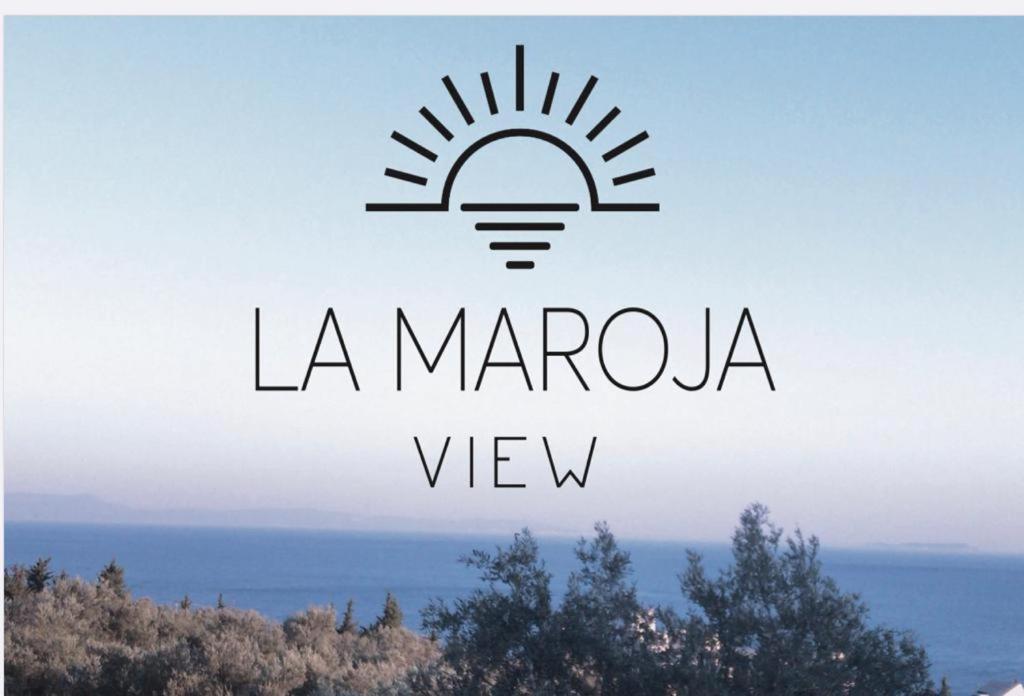 a sign that says la maragogia view with a light bulb at La Maroja View Hotel in Dhërmi