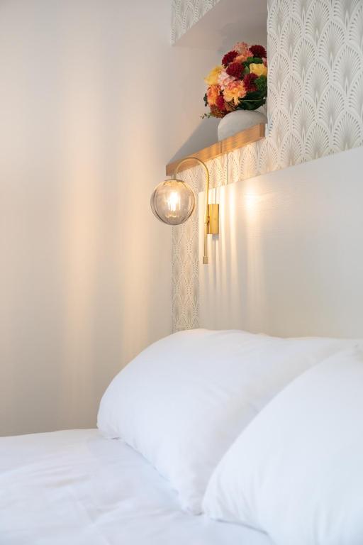Posteľ alebo postele v izbe v ubytovaní Le Maleville - Appartements de Standing