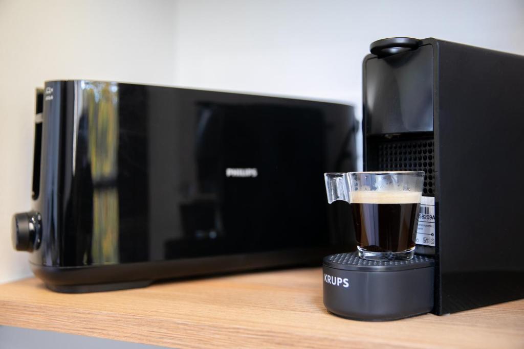 Príslušenstvo na prípravu kávy alebo čaju v ubytovaní Le Maleville - Appartements de Standing