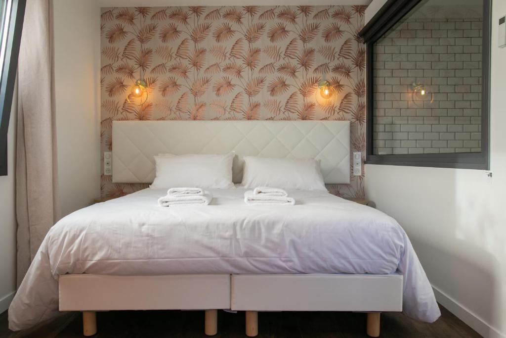 Posteľ alebo postele v izbe v ubytovaní Le Maleville - Appartements de Standing