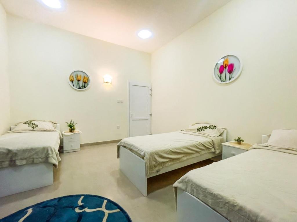 Postel nebo postele na pokoji v ubytování SHAIKHA villa