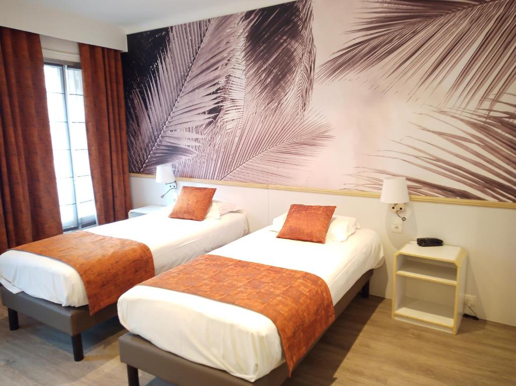 Cama o camas de una habitaci&oacute;n en Hotel Busby