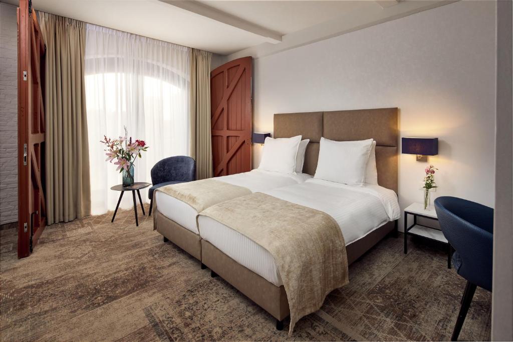 Postel nebo postele na pokoji v ubytování Van der Valk Hotel Mechelen