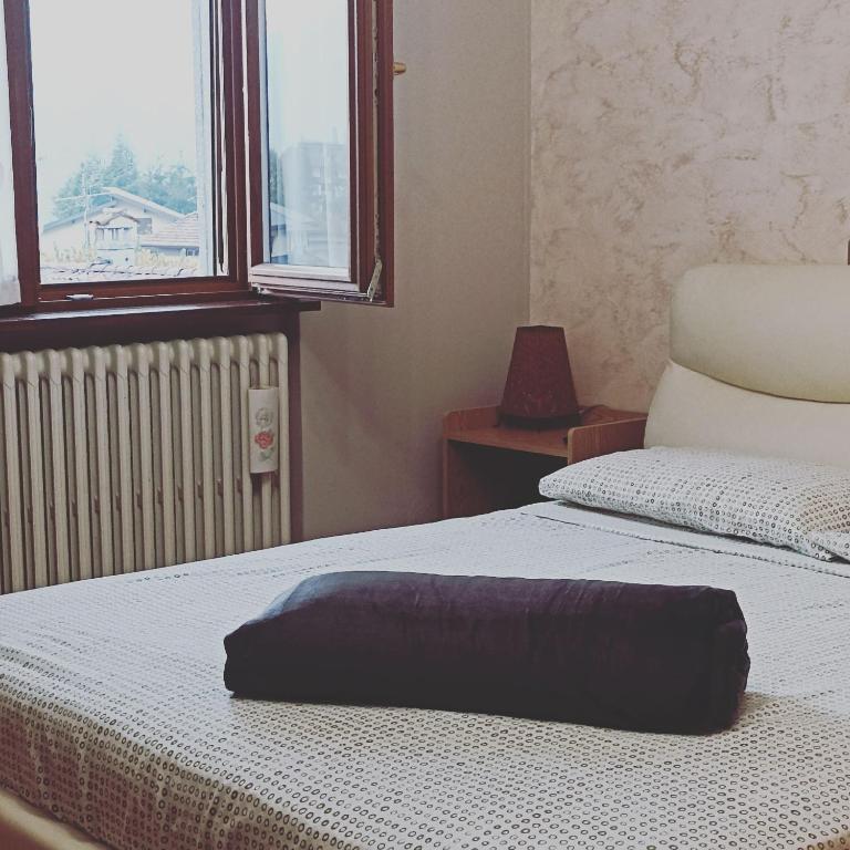 Postel nebo postele na pokoji v ubytování Barzio Paradise