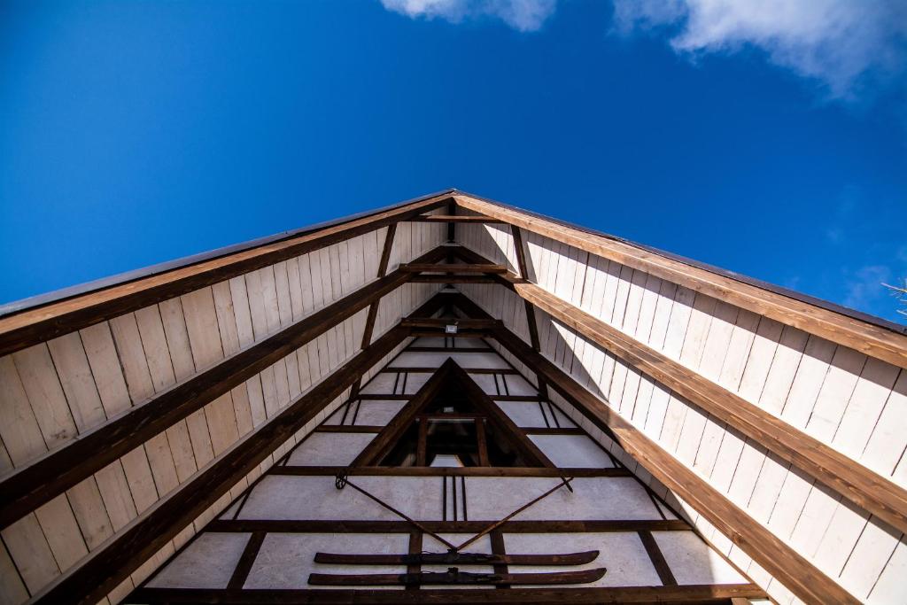 a view of the top of a wooden building at Cabanele Pași Liberi in Tău Bistra