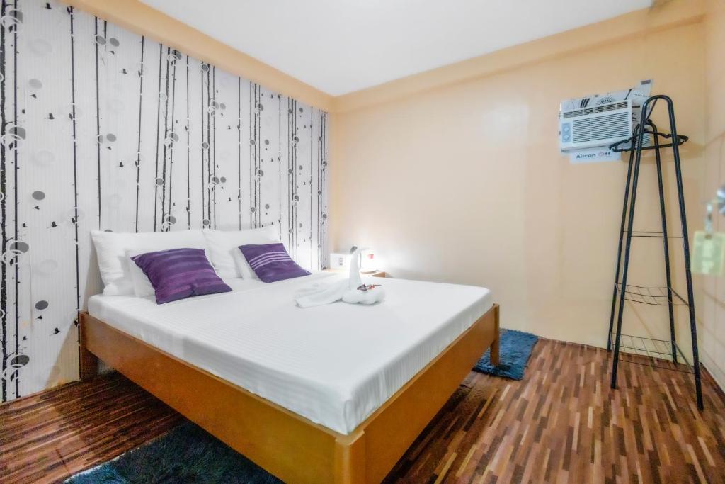Postel nebo postele na pokoji v ubytování White Shamrock Beach Hotel