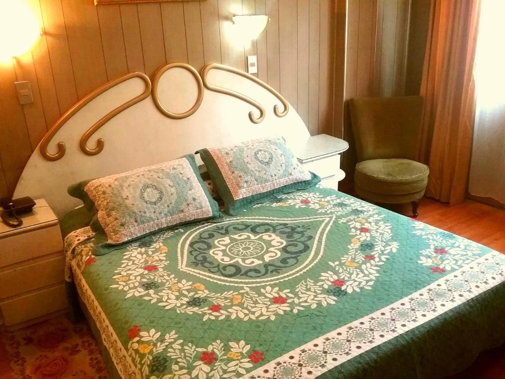 Postel nebo postele na pokoji v ubytování Hotel Di Maurier