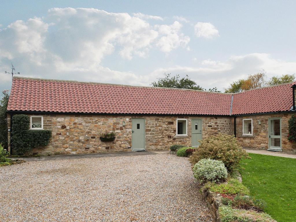 an old stone cottage with a red roof at Hurworth - 25565 in Nether Silton