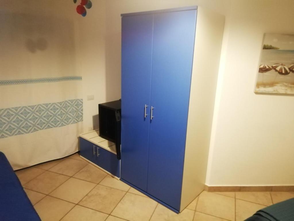 TV a/nebo společenská místnost v ubytování B&B Acquamarina Villasimius