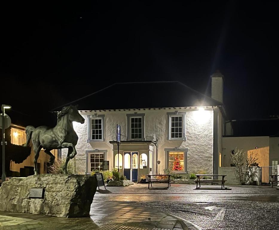 a statue of a horse in front of a building at Feathers Royal Hotel in Aberaeron
