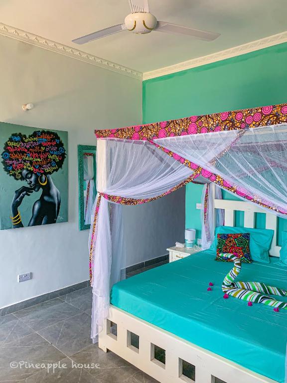 Postel nebo postele na pokoji v ubytování Pineapple House