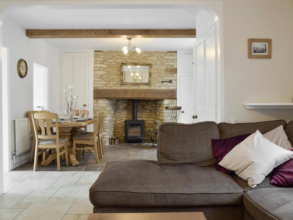 a living room with a couch and a table at The Plough in Bampton