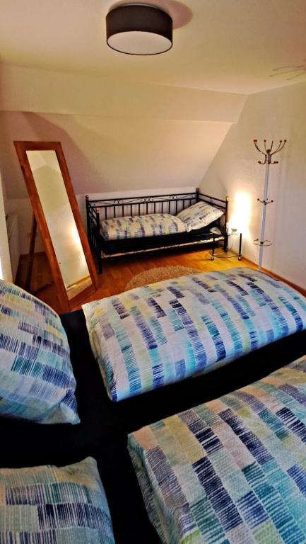 Postel nebo postele na pokoji v ubytování Deichstube-Greetsiel