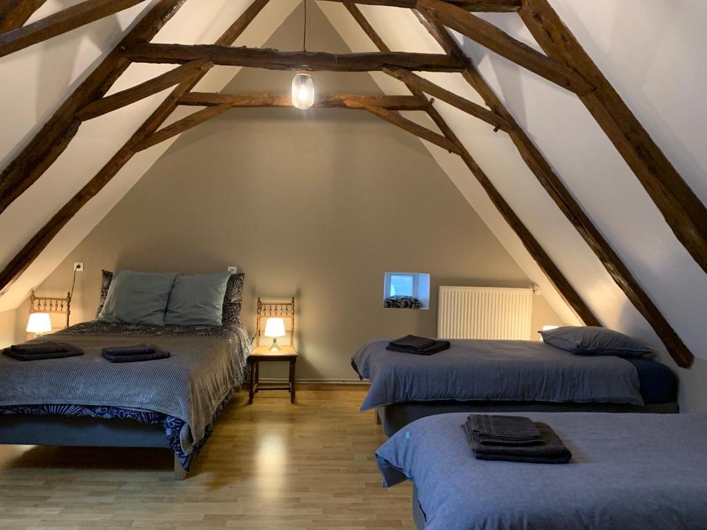 Ένα ή περισσότερα κρεβάτια σε δωμάτιο στο Gîte de SAY