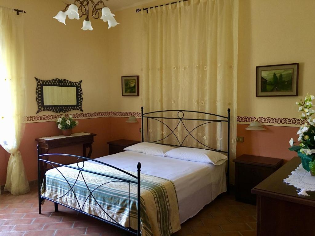 Postel nebo postele na pokoji v ubytování agriturismo macchia al pino