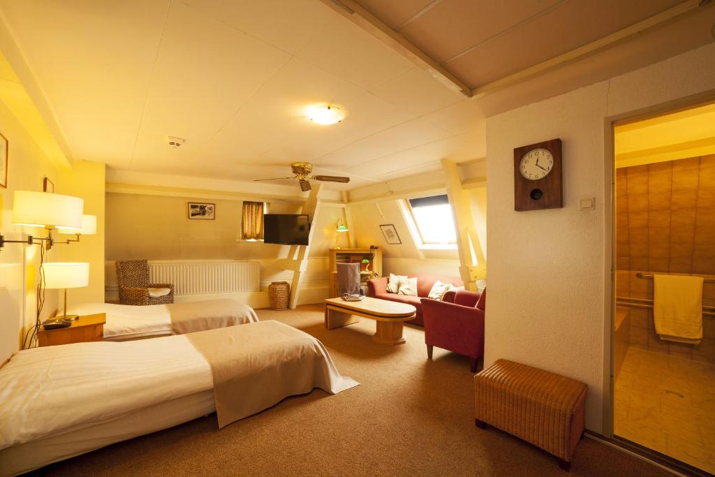 Postel nebo postele na pokoji v ubytování Hotel Dordrecht
