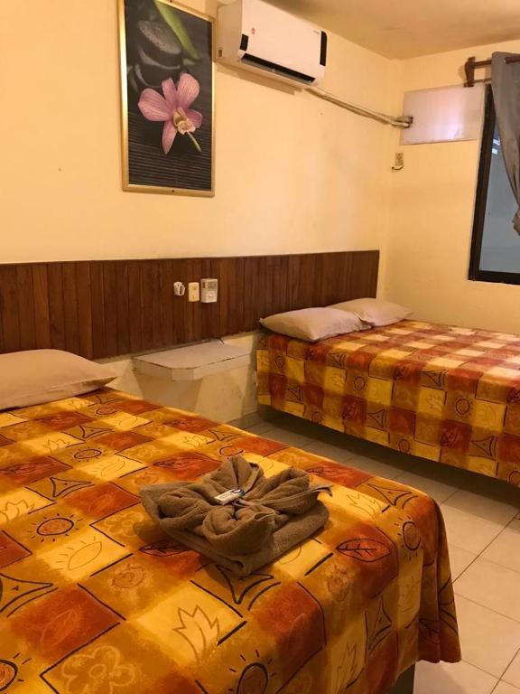 Postel nebo postele na pokoji v ubytování Hotel Sociedad y Maristas