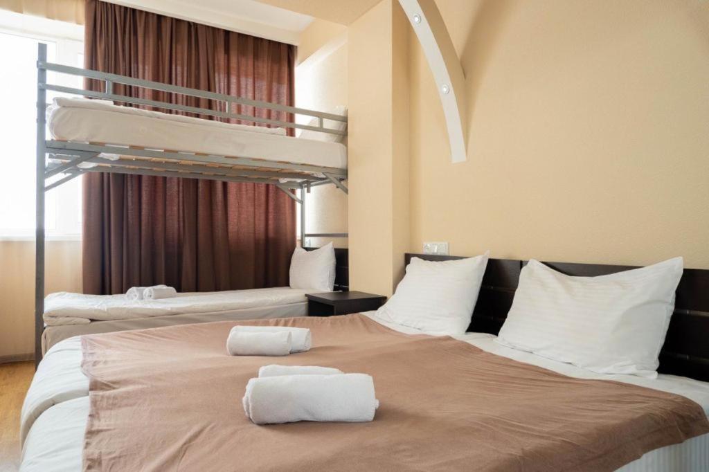 Postel nebo postele na pokoji v ubytování Gudauri Club 2100 Apt206