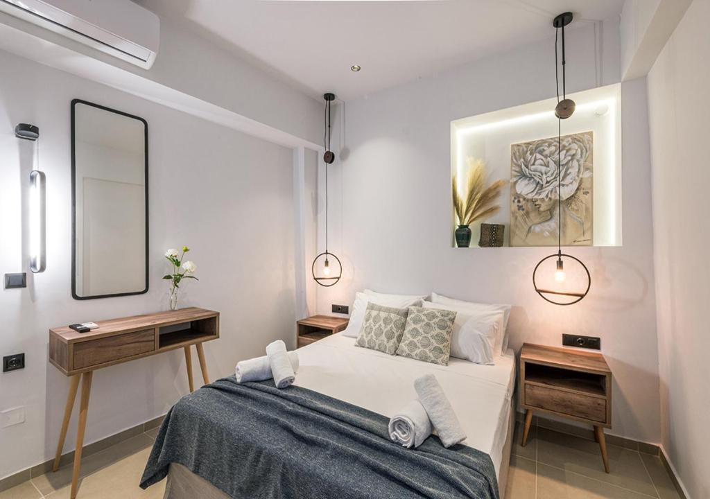 Katil atau katil-katil dalam bilik di Noemie Apartments