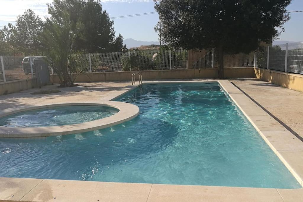 a small swimming pool with a circular poolvisor at Casa de campo muy grande, con piscina y pistas in Fortuna