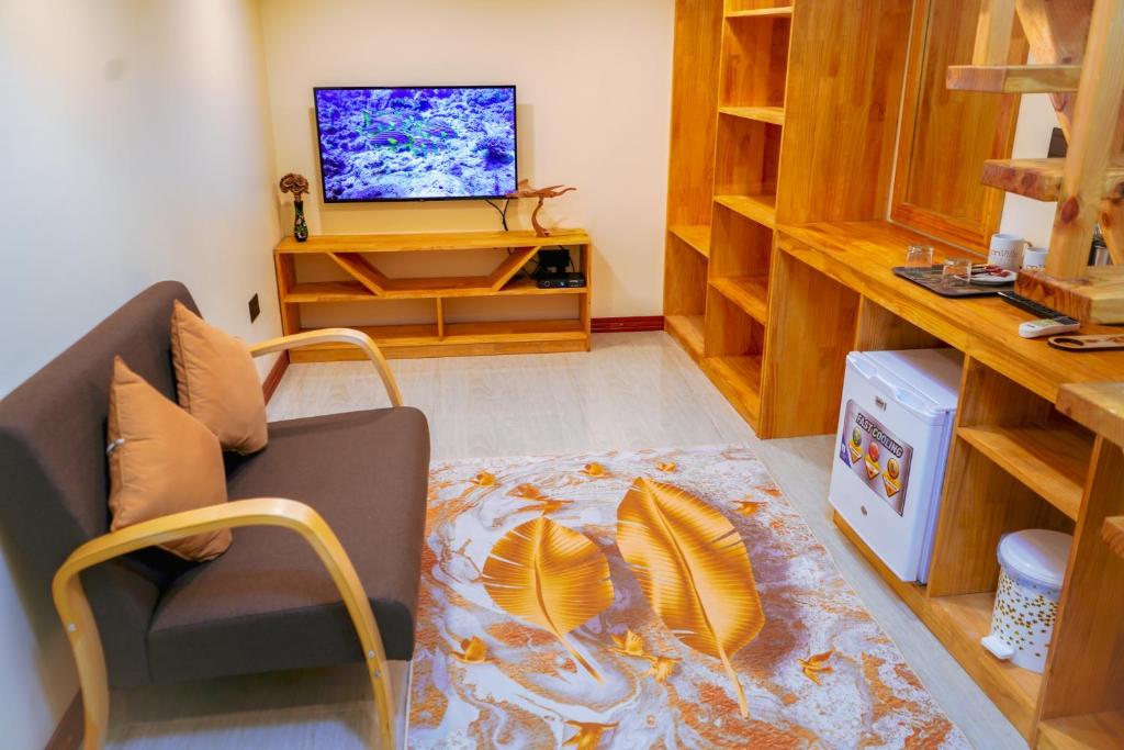 TV a/nebo společenská místnost v ubytování Banyan Villa Maldives Dhangethi