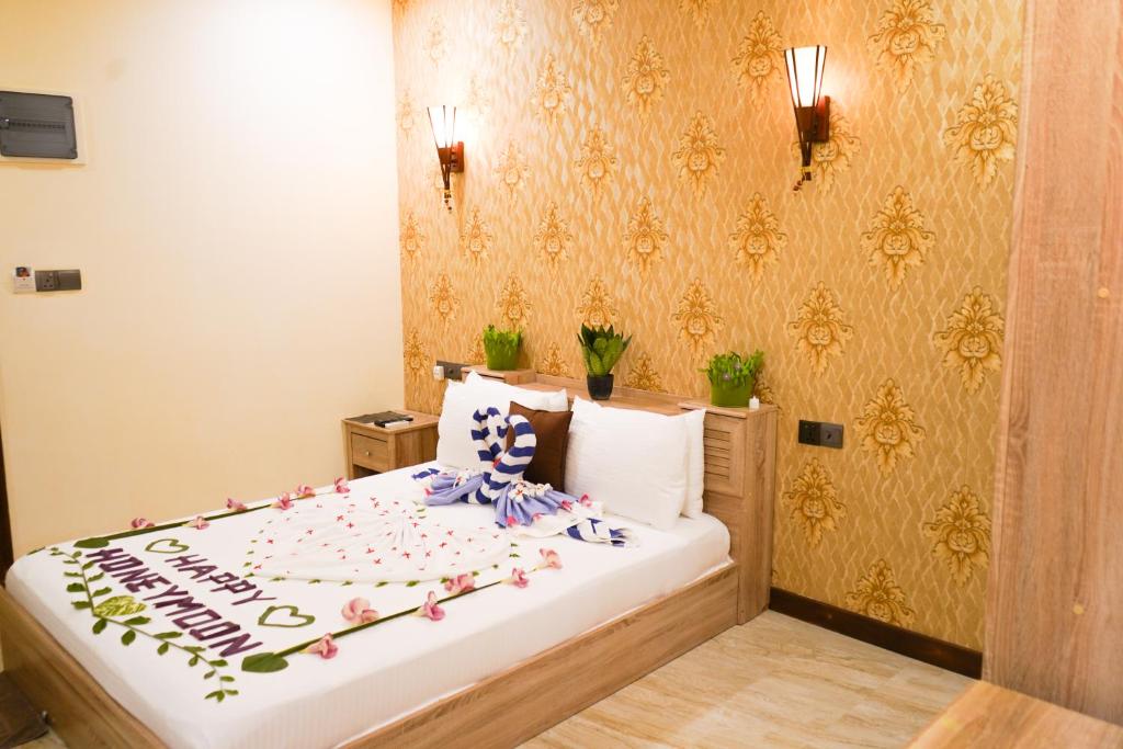 Postel nebo postele na pokoji v ubytování Banyan Villa Maldives Dhangethi