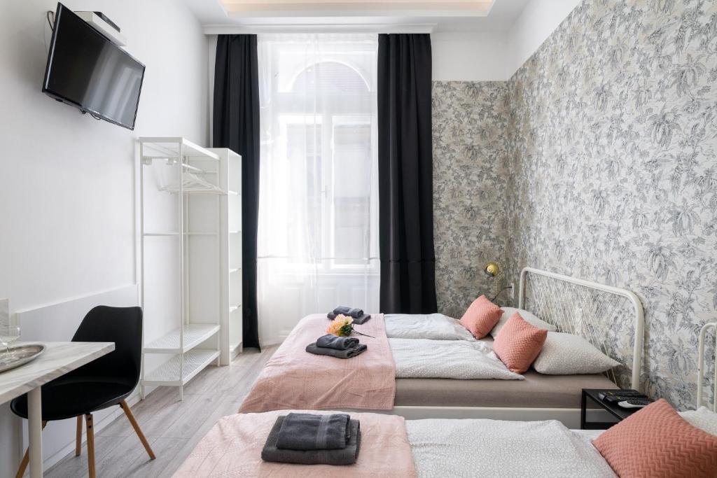 Posteľ alebo postele v izbe v ubytovaní Delta Apartments Budapest