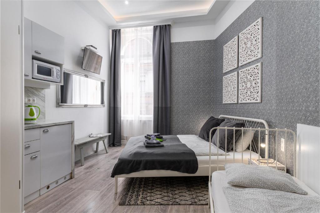 Posteľ alebo postele v izbe v ubytovaní Delta Apartments Budapest