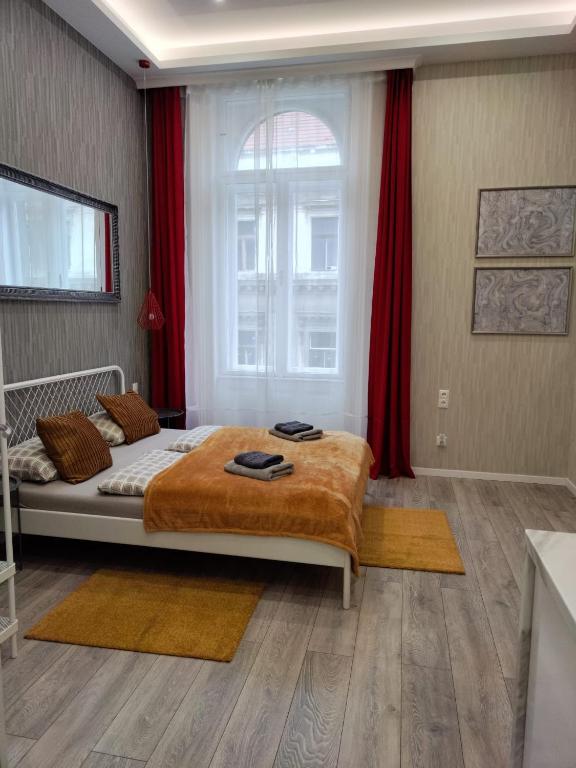Posteľ alebo postele v izbe v ubytovaní Delta Apartments Budapest