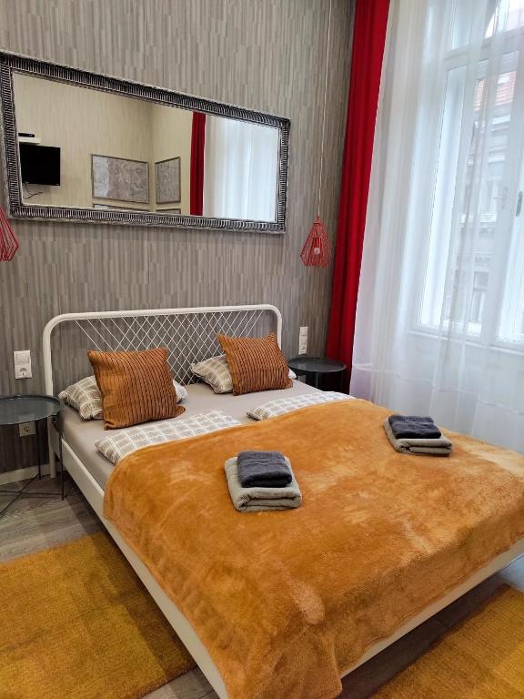 Posteľ alebo postele v izbe v ubytovaní Delta Apartments Budapest