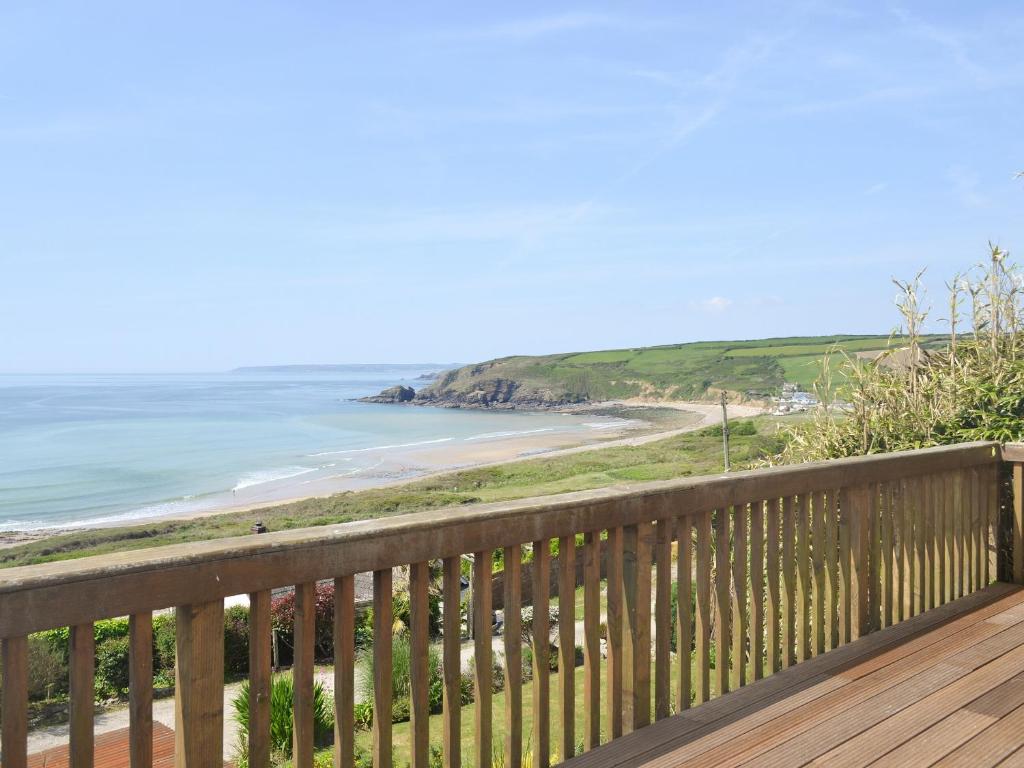 a view of the beach from the deck of a house at Hillside in Praa Sands