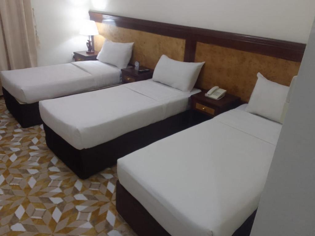 A bed or beds in a room at اوتاد المتحدة