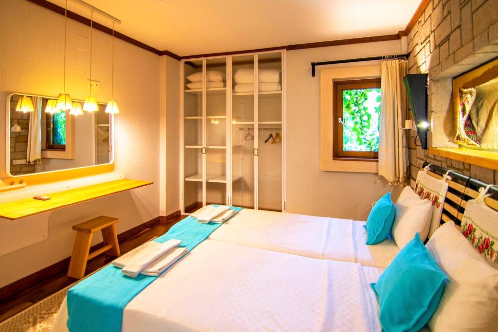 A bed or beds in a room at Dalyan Villa StoneHouse-1