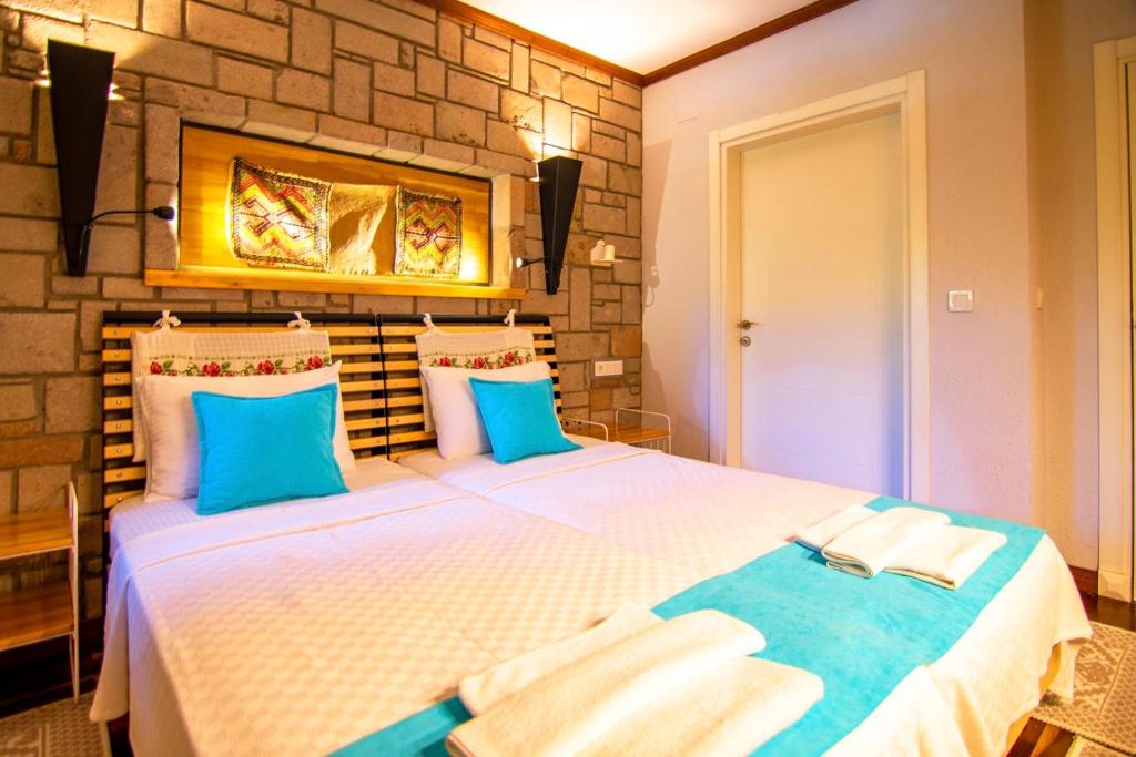 A bed or beds in a room at Dalyan Villa StoneHouse-1