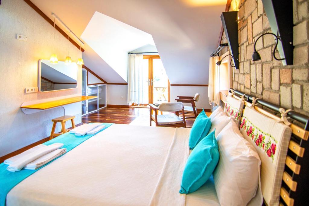 A bed or beds in a room at Dalyan Villa StoneHouse-1