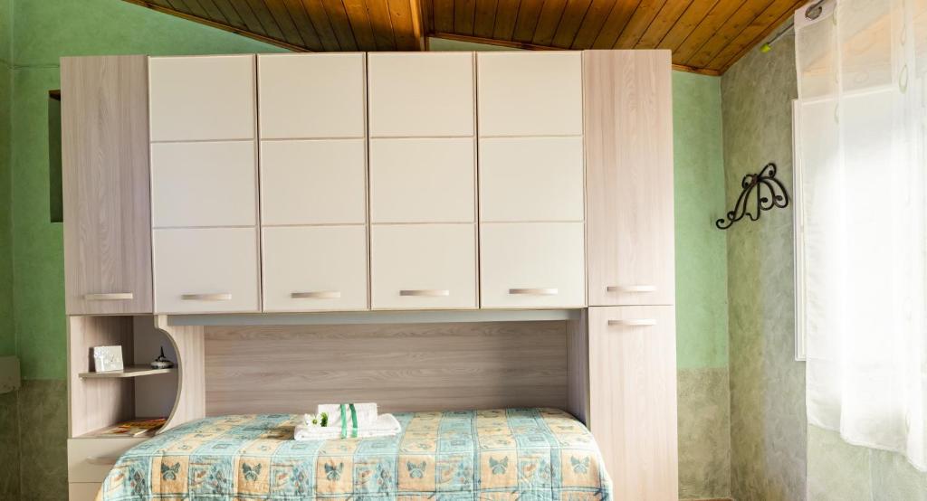 Łóżko lub łóżka w pokoju w obiekcie Villa Laura