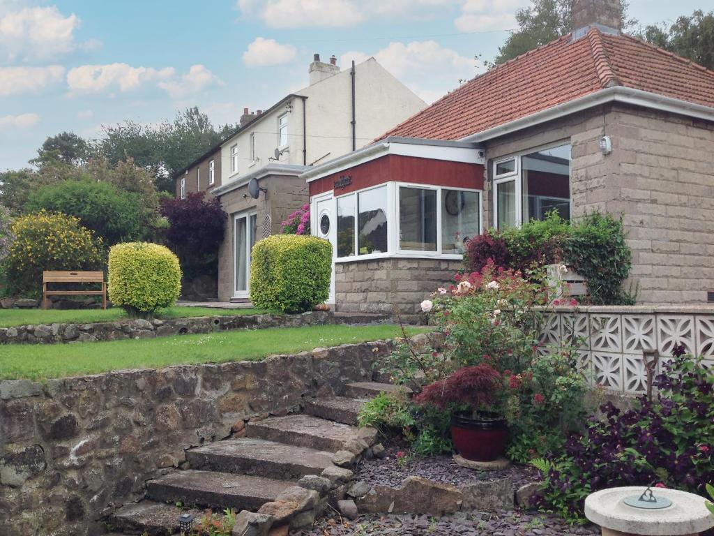 a house with a stone stairway in front of it at Casa Nostro - 27825 in Wooler