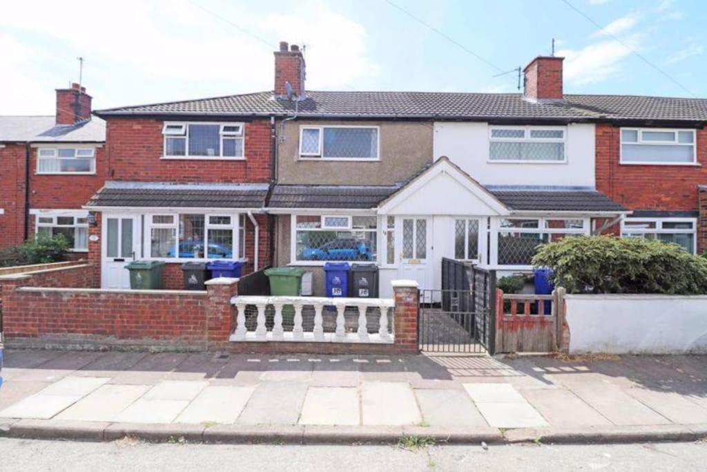 a house with a fence in front of it at Seaside 2 bed Townhouse, near Cleethorpes station in Cleethorpes