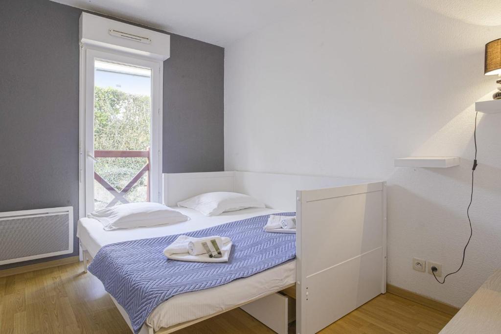 Postel nebo postele na pokoji v ubytování Appartement des 3 Couronnes - Welkeys